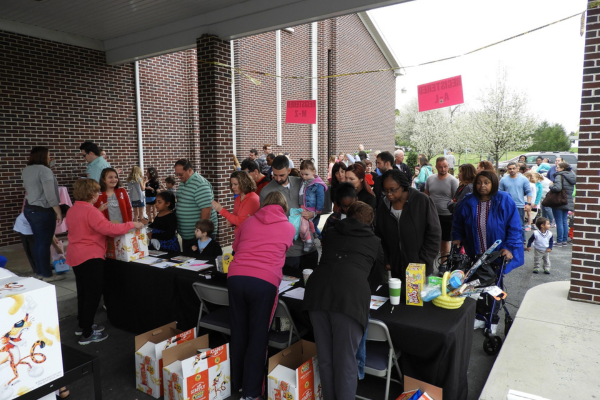 Volunteers in blue shirts